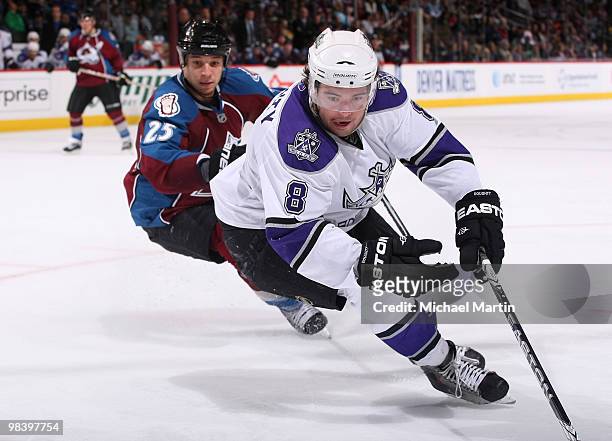 Drew Doughty of the Los Angeles Kings skates against Chris Stewart of the Colorado Avalanche at the Pepsi Center on April 11, 2010 in Denver,...