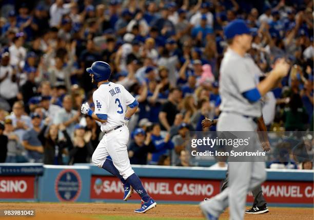 Los Angeles Dodgers infielder Chris Taylor hits a solo home run in the bottom of the eighth inning during the game against the Chicago Cubs on June...