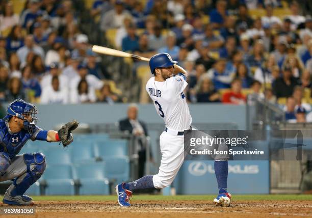 Los Angeles Dodgers infielder Chris Taylor hits a solo home run in the bottom of the eighth inning during the game against the Chicago Cubs on June...
