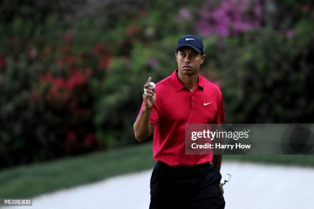 Tiger Woods celebrates after a birdie putt on the 13th hole during the final round of the 2010 Masters Tournament at Augusta National Golf Club on...