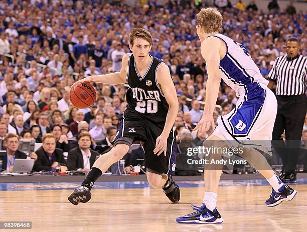 Gordon Hayward of the Butler Bulldogs drives against Kyle Singler of the Duke Blue Devils during the 2010 NCAA Division I Men's Basketball National...