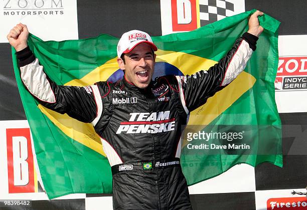 Helio Castroneves of Brazil, driver of the Team Penske Dallara Honda celebrates in victory lane after winning the Indy Grand Prix of Alabama at the...