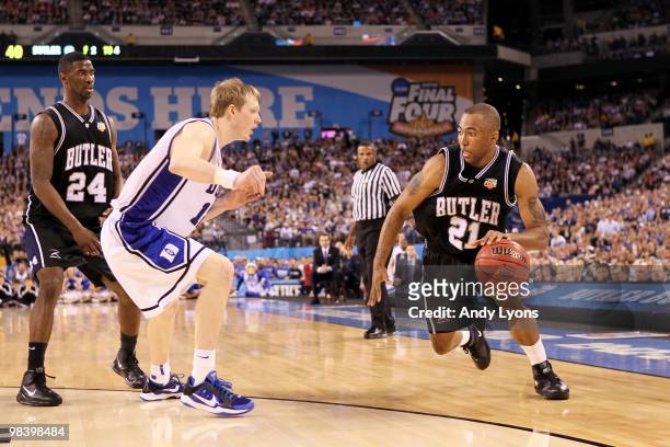 Willie Veasley of the Butler Bulldogs drives against Kyle Singler of the Duke Blue Devils during the 2010 NCAA Division I Men's Basketball National...