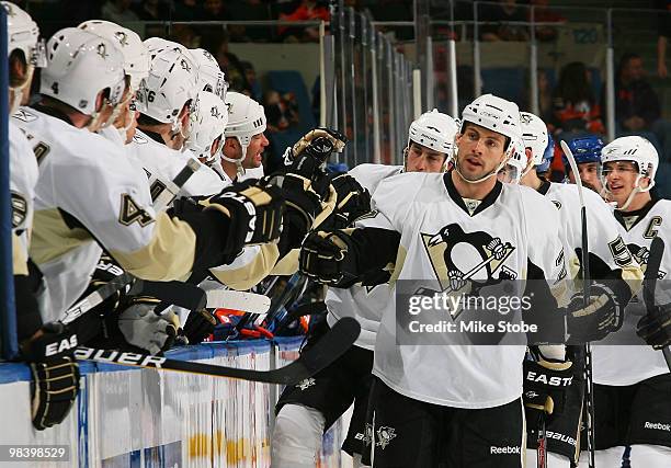 Eric Godard of the Pittsburgh Penguins is congratulated on his first period goal in the game against the New York Islanders on April 11, 2010 at...