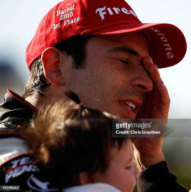 Helio Castroneves of Brazil, driver of the Team Penske Dallara Honda celebrates with his daughter Mikaella after winning the IRL IndyCar Series Grand...