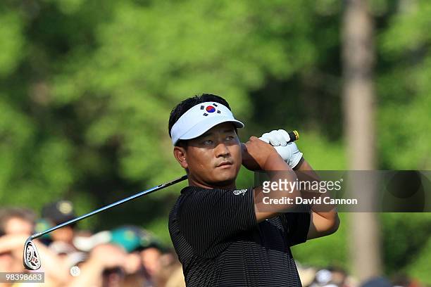 Choi of South Korea watches his tee shot on the 12th hole during the final round of the 2010 Masters Tournament at Augusta National Golf Club on...