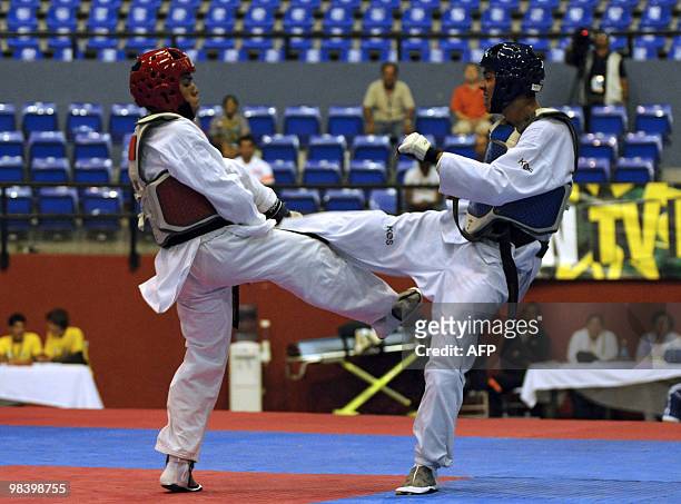 Costa Rican Rafael Castro fights with Salvadorean Abner Sanchez in the Taekwondo category M - Fly during the IX Central American Games in Panama City...
