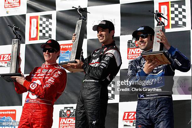 Second place Scott Dixon of New Zealand, driver of the Target Chip Ganassi Racing Dallara Honda, winner Helio Castroneves of Brazil, driver of the...