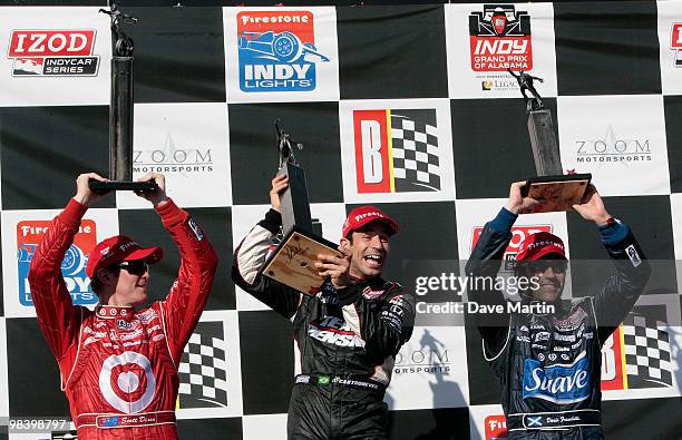 Helio Castroneves of Brazil, driver of the Team Penske Dallara Honda celebrates in victory lane with second place finisher Scott Dixon , driver of...