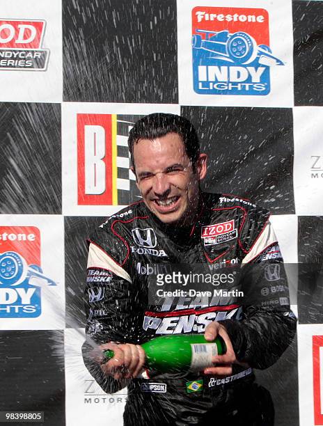 Helio Castroneves of Brazil, driver of the Team Penske Dallara Honda celebrates in victory lane after winning the Indy Grand Prix of Alabama at the...