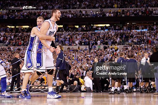 Brian Zoubek and Jon Scheyer of the Duke Blue Devils celebrate after the Blue Devils won 61-59 against the Butler Bulldogs in the 2010 NCAA Division...