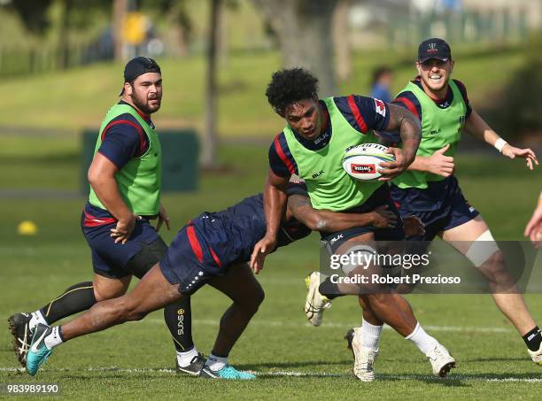 Lopeti Timani is tackled during a Melbourne Rebels Super Rugby training session at AAMI Park on June 26, 2018 in Melbourne, Australia.