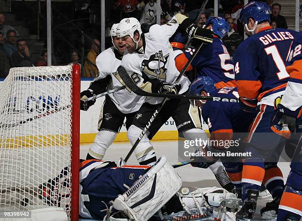 Eric Godard of the Pittsburgh Penguins scores his 1st goal of the season in the second period against the New York Islanders at the Nassau Coliseum...