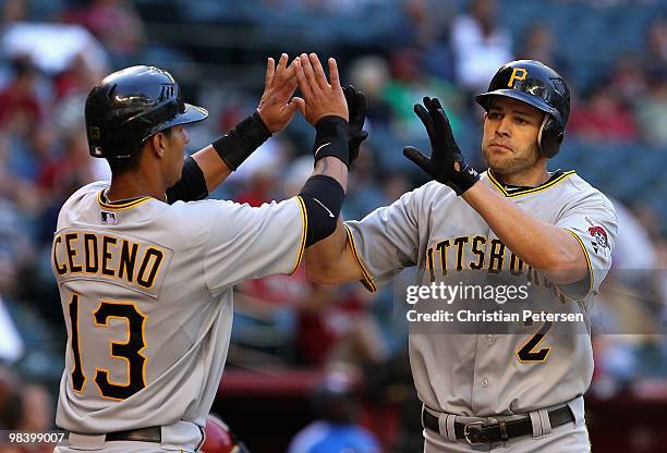 Bobby Crosby of the Pittsburgh Pirates is congratulated by teammate Ronny Cedeno after Crosby hit a 2 run home run against the Arizona Diamondbacks...