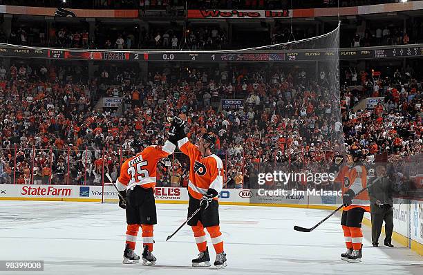 Matt Carle, Jeff Carter, and Arron Asham of the Philadelphia Flyers celebrate after defeating the New York Rangers on April 11, 2010 at Wachovia...