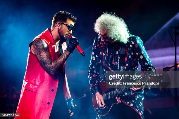 Adam Lambert and Brian May of Queen perform on stage at Mediolanum Forum on June 25, 2018 in Milan, Italy.