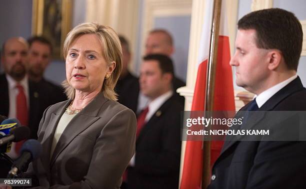 Secretary of State Hillary Clinton speaks with Polish Ambassador to the US Robert Kupiecki after signing the condolence book at the Polish embassy in...