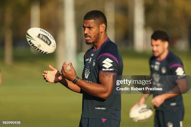 Tui Kamikamica looks to offload the ball during a Melbourne Storm NRL media opportunity at Gosch's Paddock on June 26, 2018 in Melbourne, Australia.