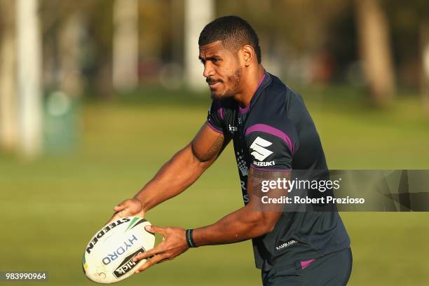 Tui Kamikamica offloads the ball during a Melbourne Storm NRL media opportunity at Gosch's Paddock on June 26, 2018 in Melbourne, Australia.