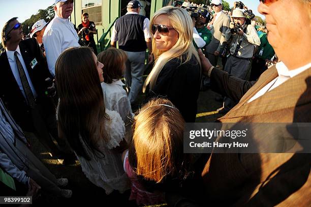 Amy Mickelson waits with her children Amanda, Evan and Sophia after Phil Mickelson's three-stroke victory at the 2010 Masters Tournament at Augusta...