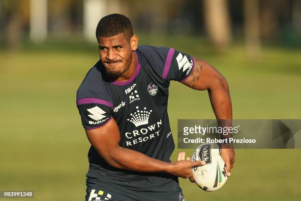 Tui Kamikamica offloads the ball during a Melbourne Storm NRL media opportunity at Gosch's Paddock on June 26, 2018 in Melbourne, Australia.