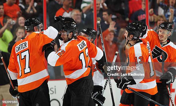 Jeff Carter, Simon Gagne, Dan Carcillo and Lukas Krajicek of the Philadelphia Flyers all celebrate a 2-1 shootout win over the New York Rangers on...