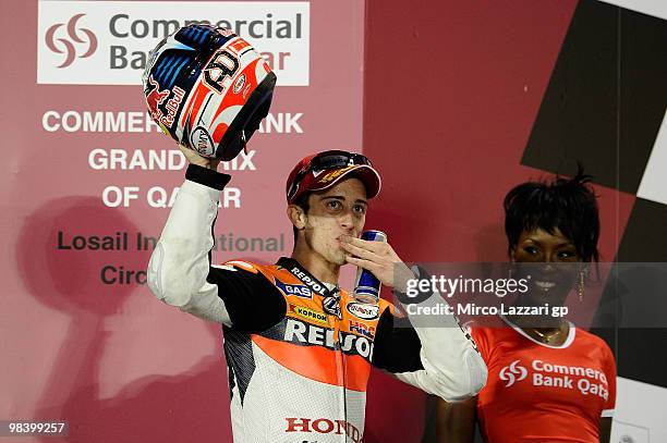 Andrea Dovizioso of Italy and Repsol Honda Team takes third place in the MotoGP of Qatar at the Losail Circuit on April 11, 2010 in Doha, Qatar.