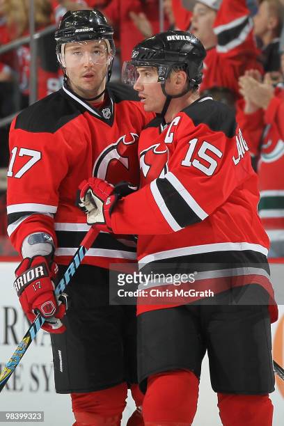 Jamie Langenbrunner of the New Jersey Devils is congratulated by team mate Ilya Kovalchuk after scoring the winning goal against the Buffalo Sabres...