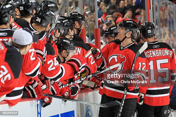 Brian Rolston of the New Jersey Devils celebrates victory with team mates after defeating the Buffalo Sabres at the Prudential Center on April 11,...