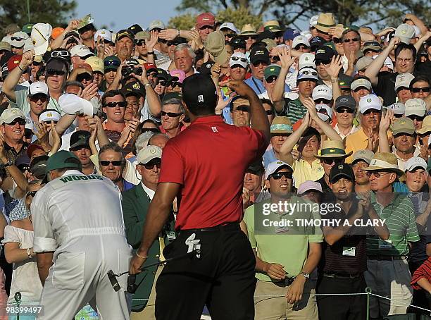 Tiger Woods of the US walks off the 18th green during the 4th round of the 2010 Masters Tournament at Augusta National Golf Club on April11, 2010 in...