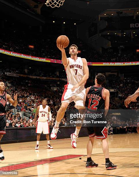 Andrea Bargnani of the Toronto Raptors gets the layup around Kirk Hinrich of the the Chicago Bulls during a game on April 11, 2010 at the Air Canada...