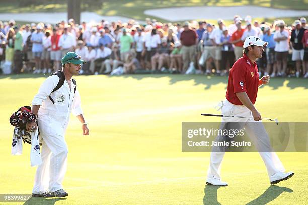 Lee Westwood of England walks with his caddie Billy Foster to the 18th green during the 2010 Masters Tournament at Augusta National Golf Club on...
