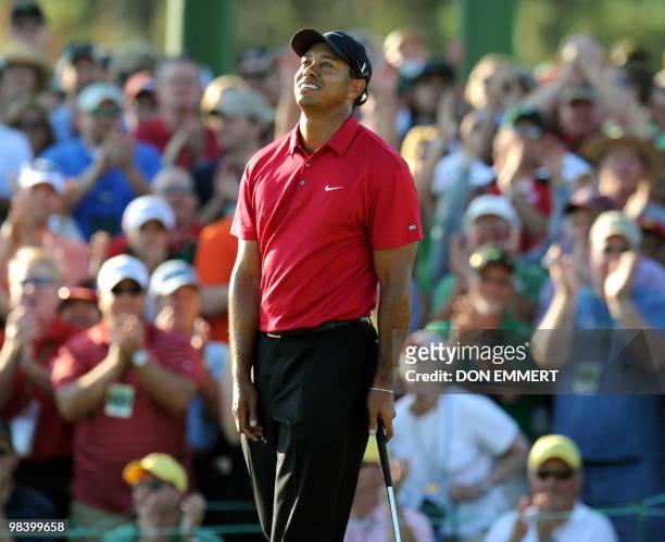 Tiger Woods of the US after sinking his putt on the 18 hole during the 2nd round of the 2010 Masters Tournament at Augusta National Golf Club on...