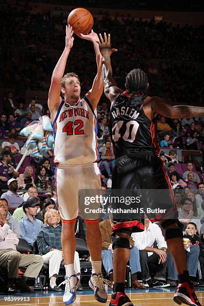 David Lee of the New York Knicks shoots against Udonis Haslem of the Miami Heat on April 11, 2010 at Madison Square Garden in New York City. NOTE TO...