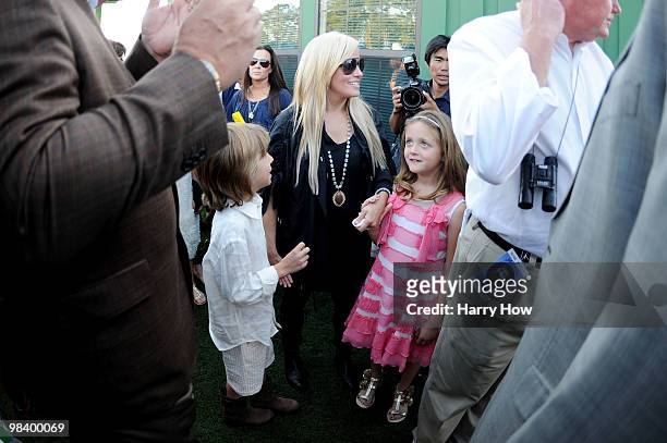Phil Mickelson's wife Amy , his son Evan and daughter Sophia celebrate his three-stroke victory to win the 2010 Masters Tournament at Augusta...