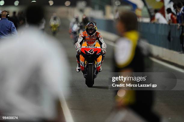 Andrea Dovizioso of Italy and Repsol Honda Team arrives at the end of the MotoGP of Qatar at Losail Circuit on April 11, 2010 in Doha, Qatar.