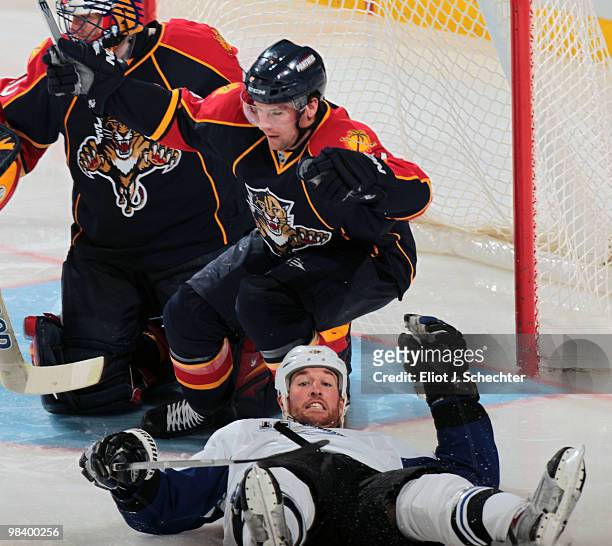 Ryan Malone of the Tampa Bay Lightning collides with Keith Ballard of the Florida Panthers at the BankAtlantic Center on April 11, 2010 in Sunrise,...