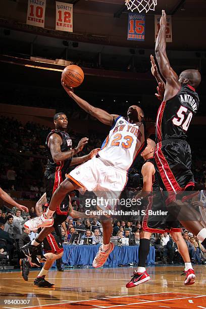 Toney Douglas of the New York Knicks shoots against Joel Anthony of the Miami Heat on April 11, 2010 at Madison Square Garden in New York City. NOTE...
