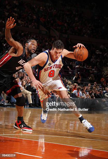 Danilo Gallinari of the New York Knicks drives against Udonis Haslem of the Miami Heat on April 11, 2010 at Madison Square Garden in New York City....
