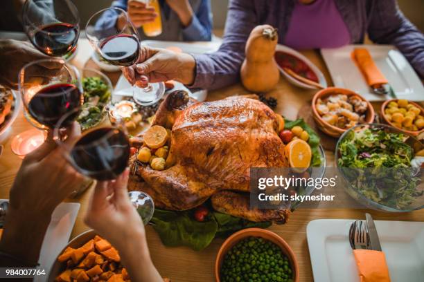 cheers to this great thanksgiving dinner! - christmas table turkey stock pictures, royalty-free photos & images