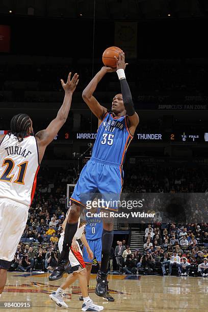 Kevin Durant of the Oklahoma City Thunder shoots a fade away over Ronny Turiaf of the Golden State Warriors on April 11, 2010 at Oracle Arena in...