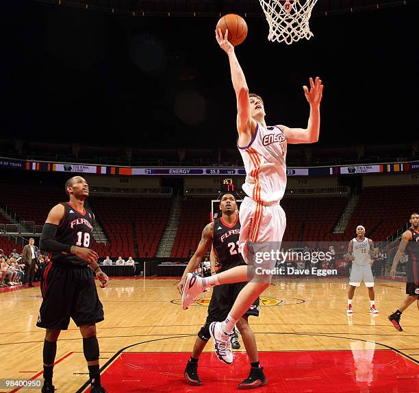 Connor Atchley of the Iowa Energy lays the ball in for two points past Gabe Pruitt and Brian Hamilton of the Utah Flash in the first half of game...