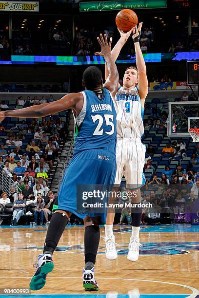 Darius Songaila of the New Orleans Hornets shoots over Al Jefferson of the Minnesota Timberwolves on April 11, 2010 at the New Orleans Arena in New...