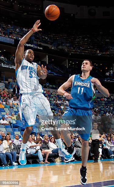 Marcus Thornton of the New Orleans Hornets shoots over Sasha Pavlovic of the Minnesota Timberwolves on April 11, 2010 at the New Orleans Arena in New...