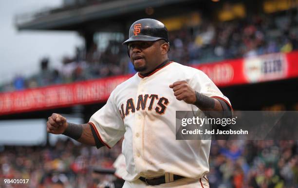 Pablo Sandoval of the San Francisco Giants celebrates after scoring on a Mark DeRosa single in the sixth innning against the Atlanta Braves during an...