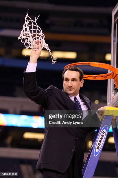 Head coach Mike Krzyzewski of the Duke Blue Devils celebrates after he cut down a piece of the net following their 61-59 win against the Butler...