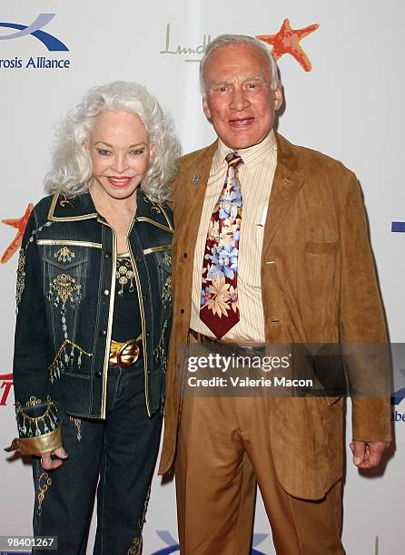 Buzz Aldrin and wife Lois Driggs Cannon arrive at the 9th Annual Comedy For a Cure Benefit at Boulevard3 on April 11, 2010 in Hollywood, California.