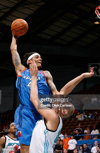 Deron Washington of the Tulsa 66ers goes for a dunk over Greg Stiemsma of the Sioux Falls Skyforce during their NBA D-League playoff game April 11,...