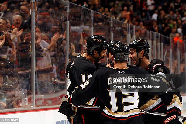 Mike Brown, Kyle Chipchura and George Parros of the Anaheim Ducks celebrate a goal in the third period from George Parros against the Edmonton Oilers...