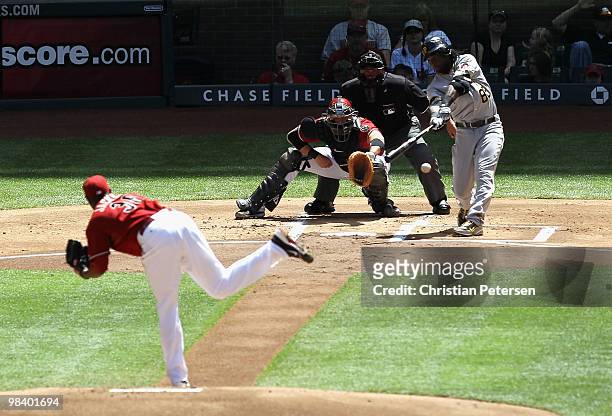 Lastings Milledge of the Pittsburgh Pirates hits a single against starting pitcher Edwin Jackson of the Arizona Diamondbacks during the first inning...